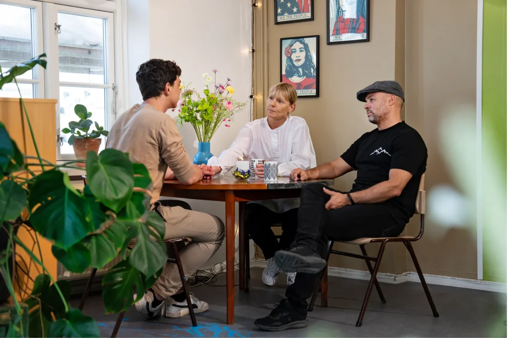 Family Son, mom and dad in conversation at headspace Family